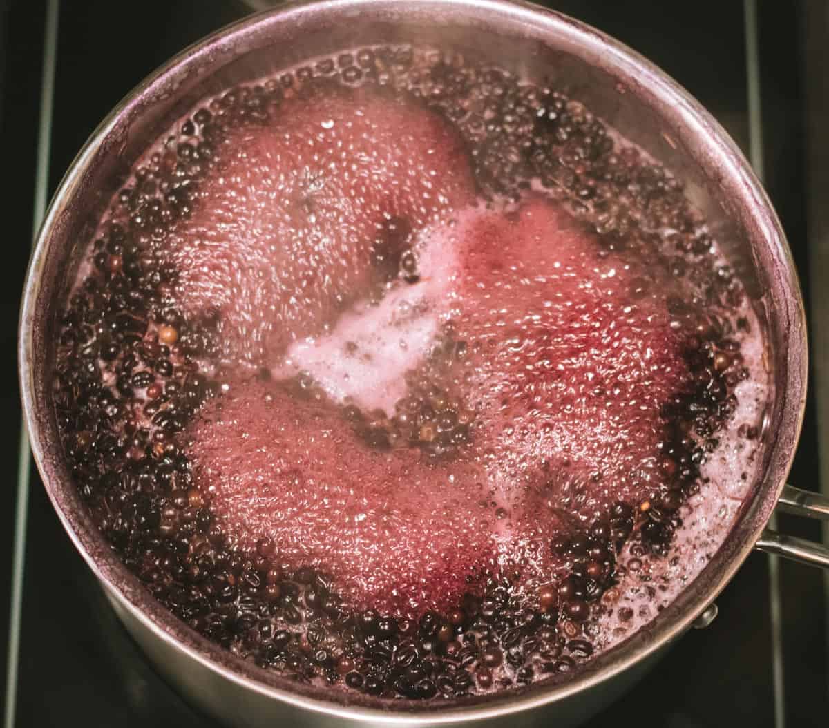 simmering the elderberries