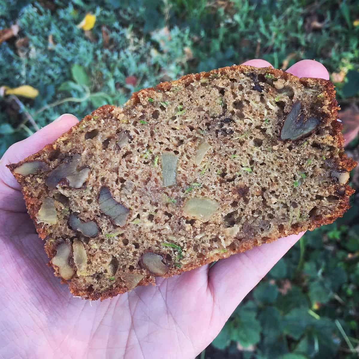 slice of zucchini spice bread with crystallized ginger