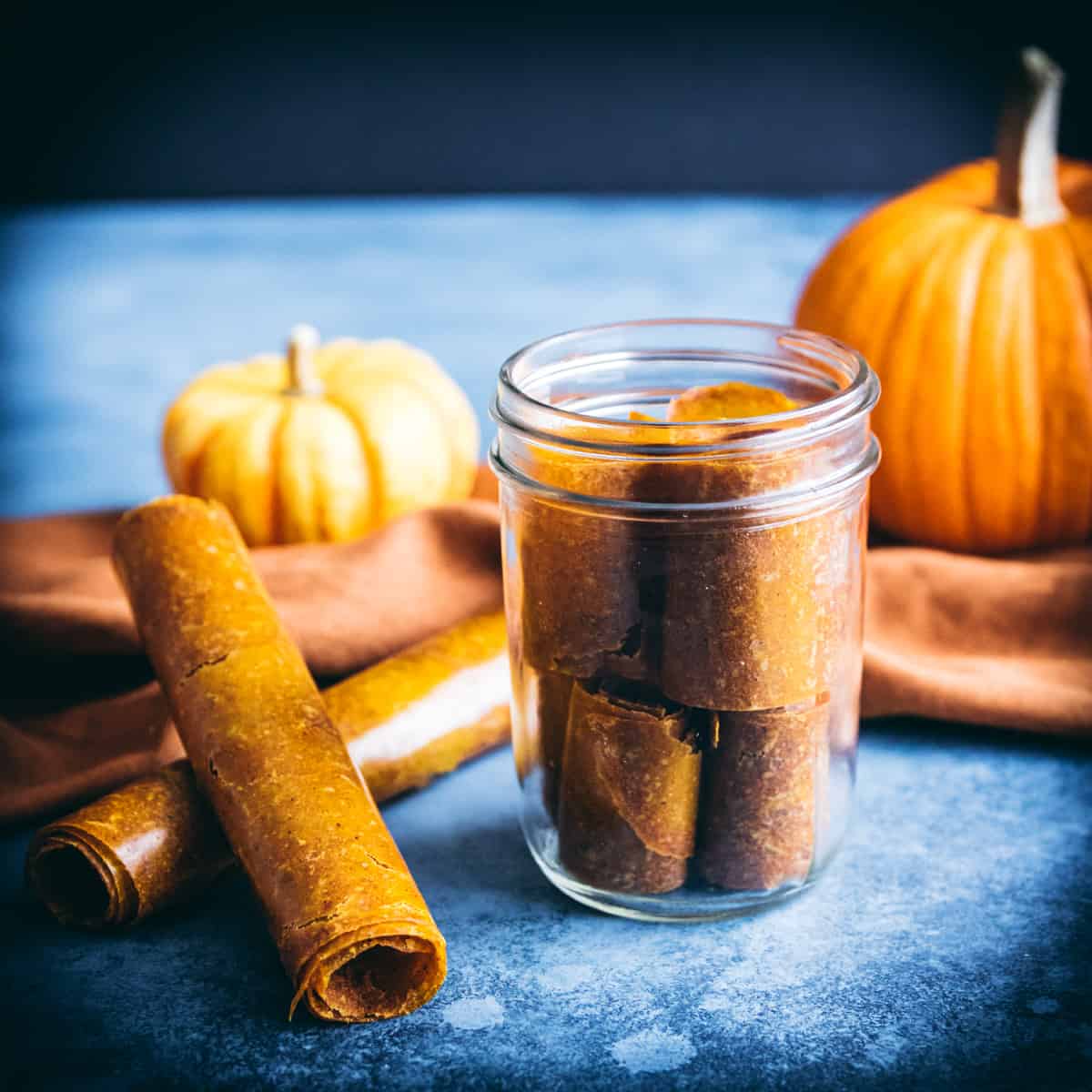 pumpkin leather rolls on a table and in a jar