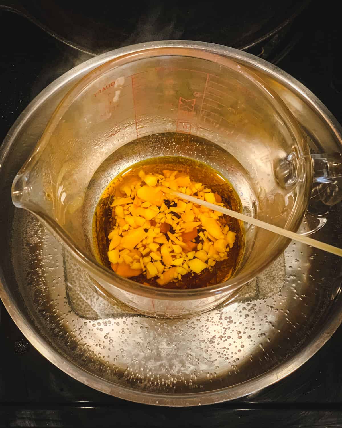 melting the beeswax into the oil in a double boiler
