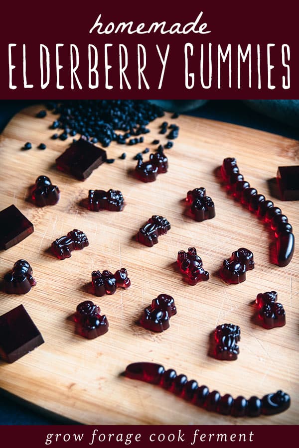elderberry gummy bears and worms on a cutting board
