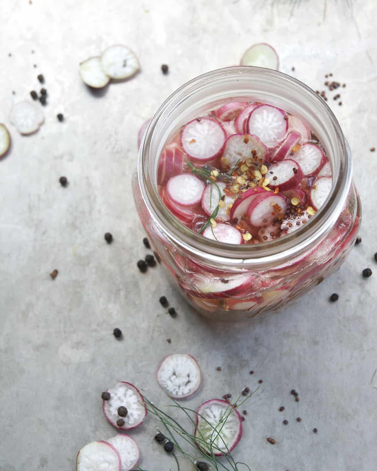 a jar of spicy pickled radishes