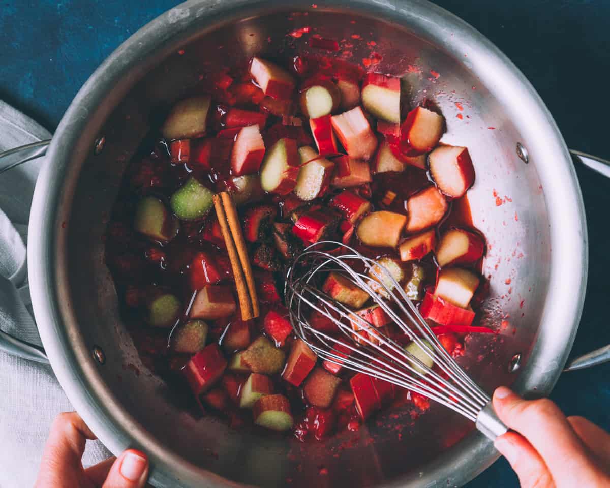 a pot with strawberries and rhubarb cooking