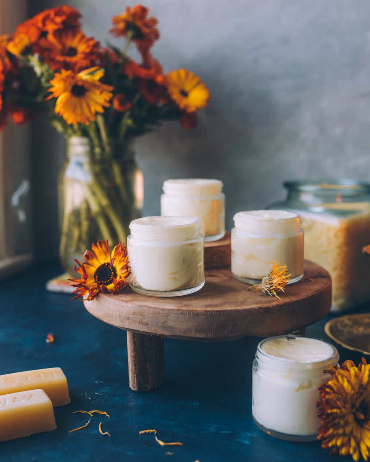 small glass jars of calendula cream