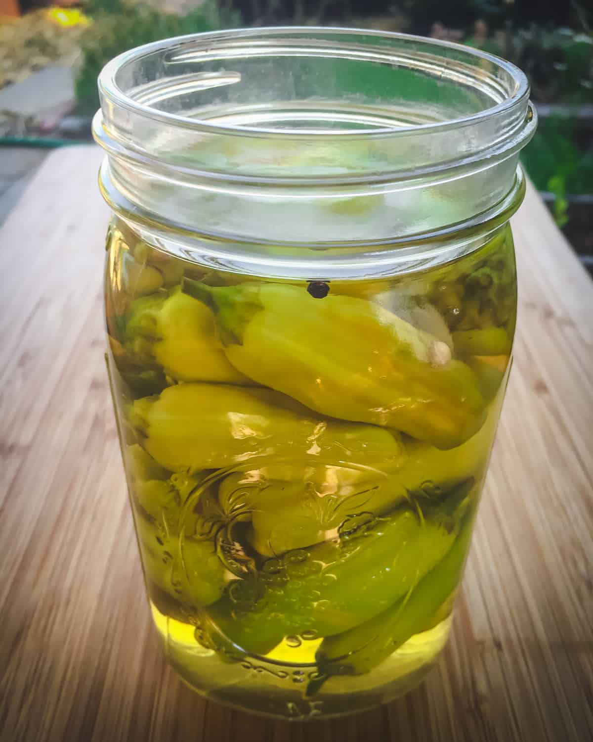 a quart jar of pickled pepperoncini peppers