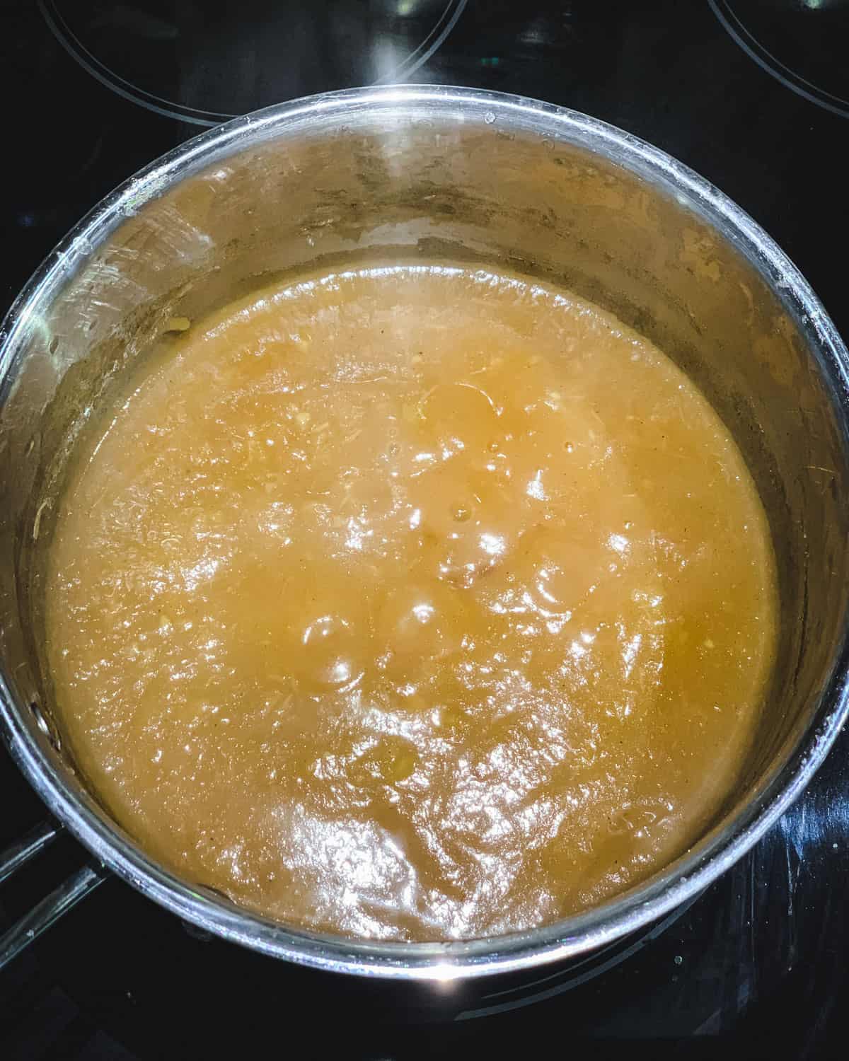 a pot boiling down the homemade apple butter