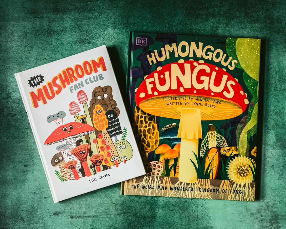 the mushroom fan club and humongous fungus books on a green table