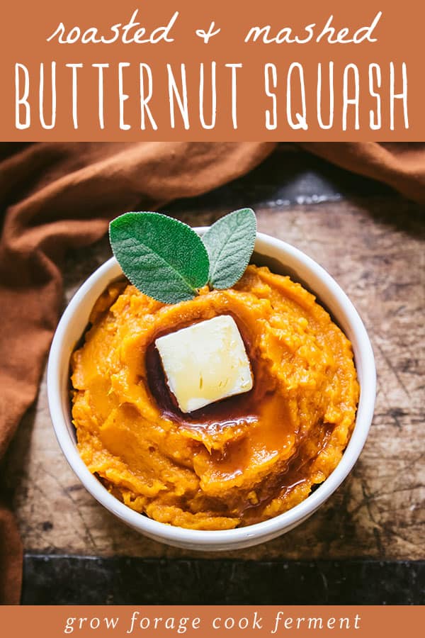 a bowl of roasted and mashed butternut squash with maple syrup, butter, and fresh sage leaves