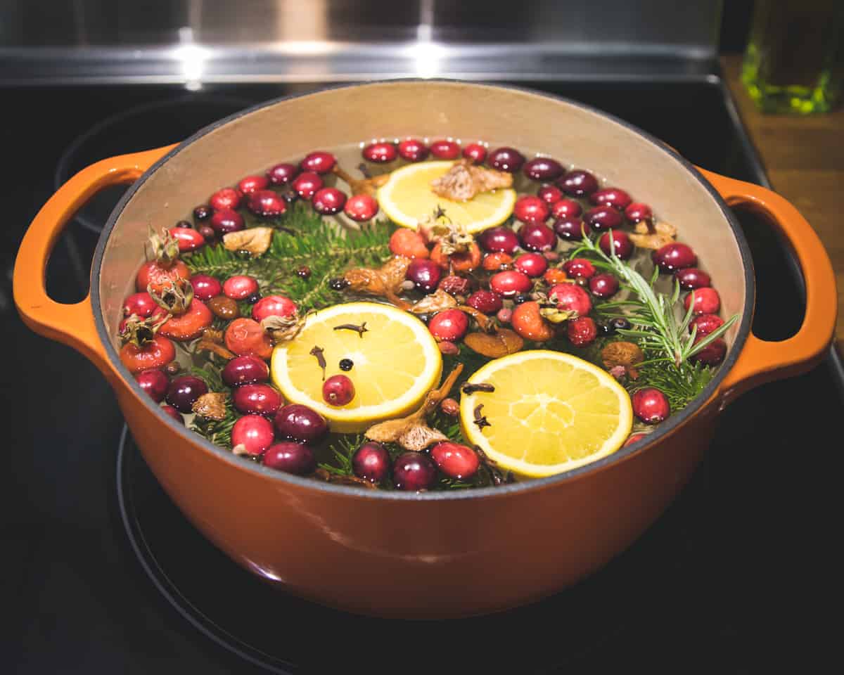 an orange simmer pot on the stove