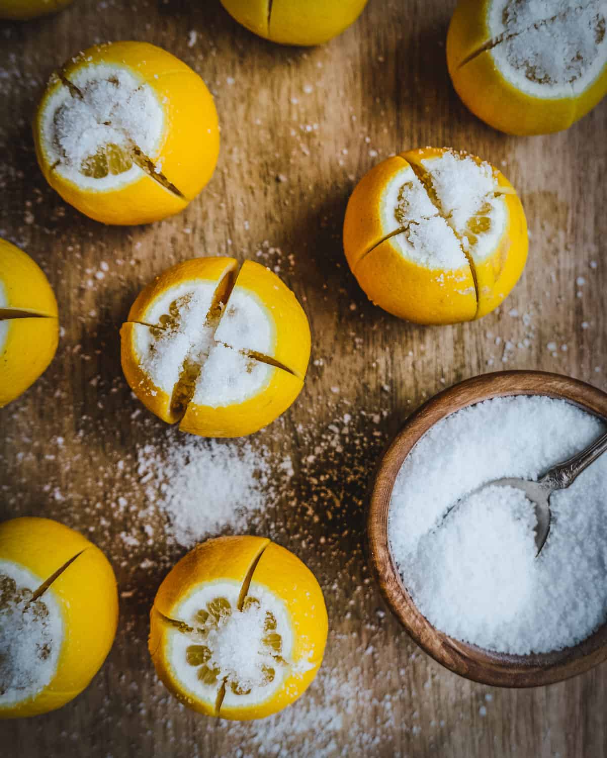 cut lemons on a cutting board with salt
