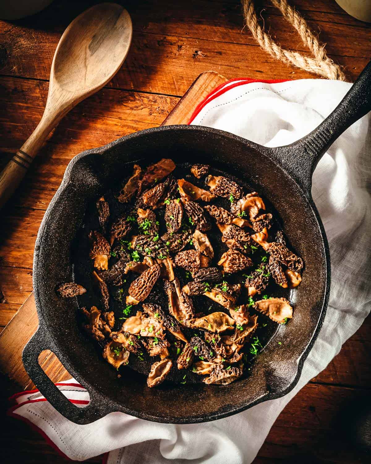 sauteed morels in a cast iron pan