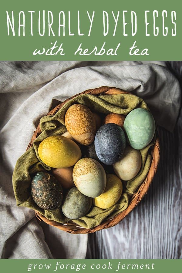 a basket of beautifully colored dyed eggs made with herbal tea