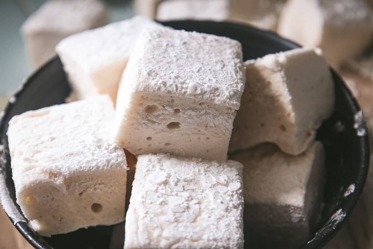 A close up of a bowl of homemade marshmallows. 
