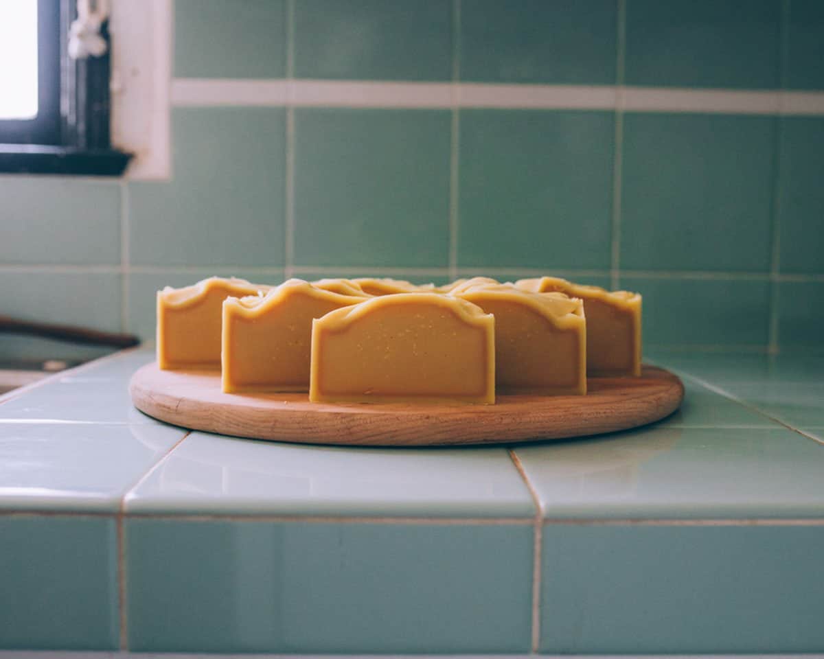 shampoo bars curing on a wooden cutting board