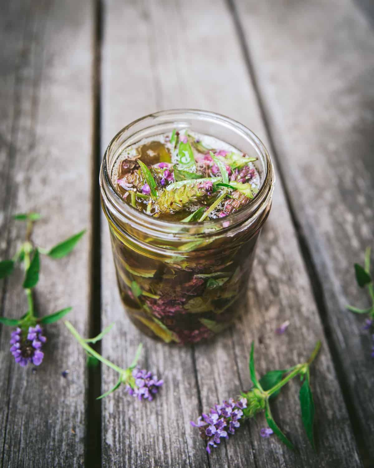 self heal oxymel being made in a pint jar