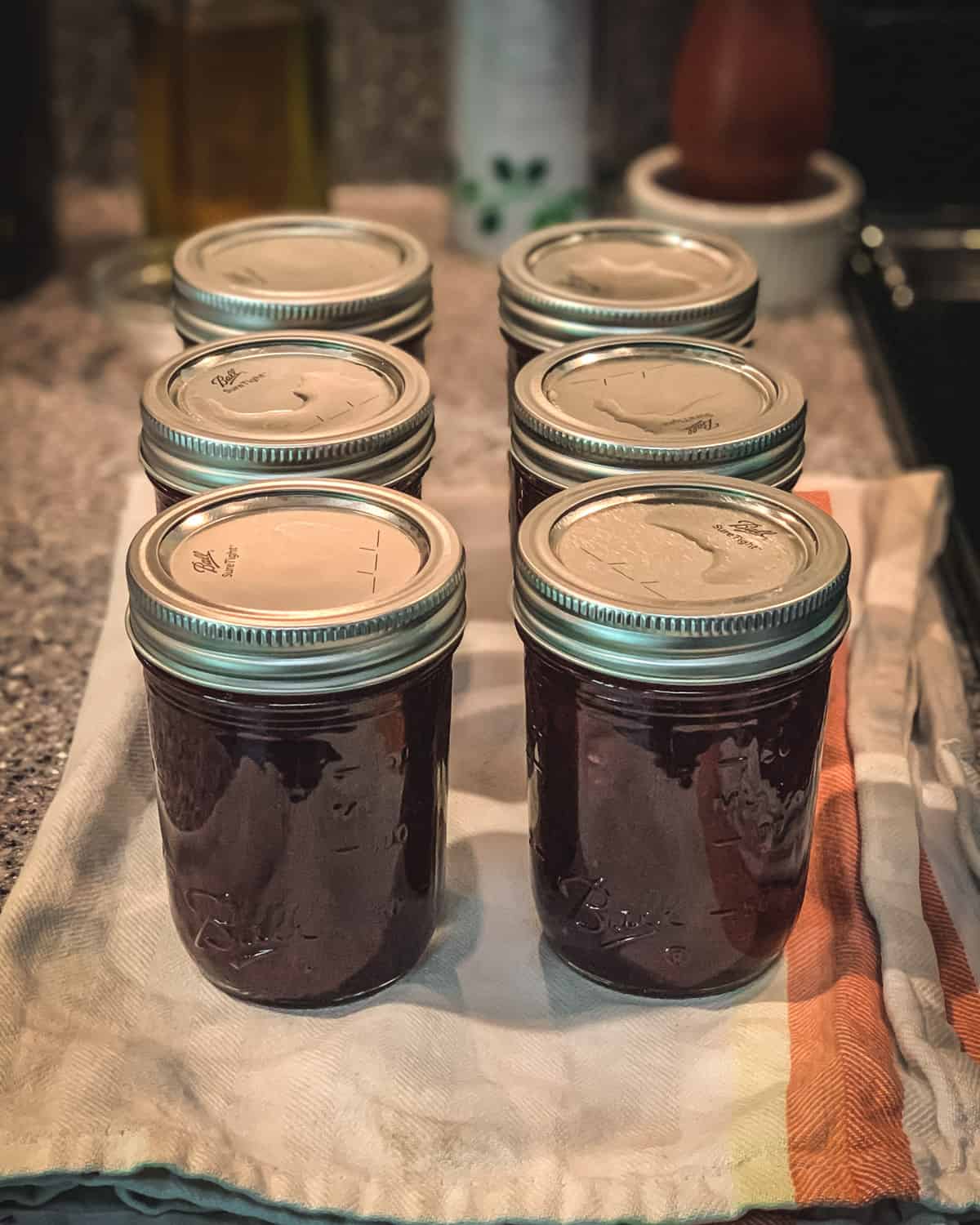 Blueberry jam in jars with lids. 