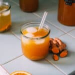 Fermented turmeric soda in a glass.