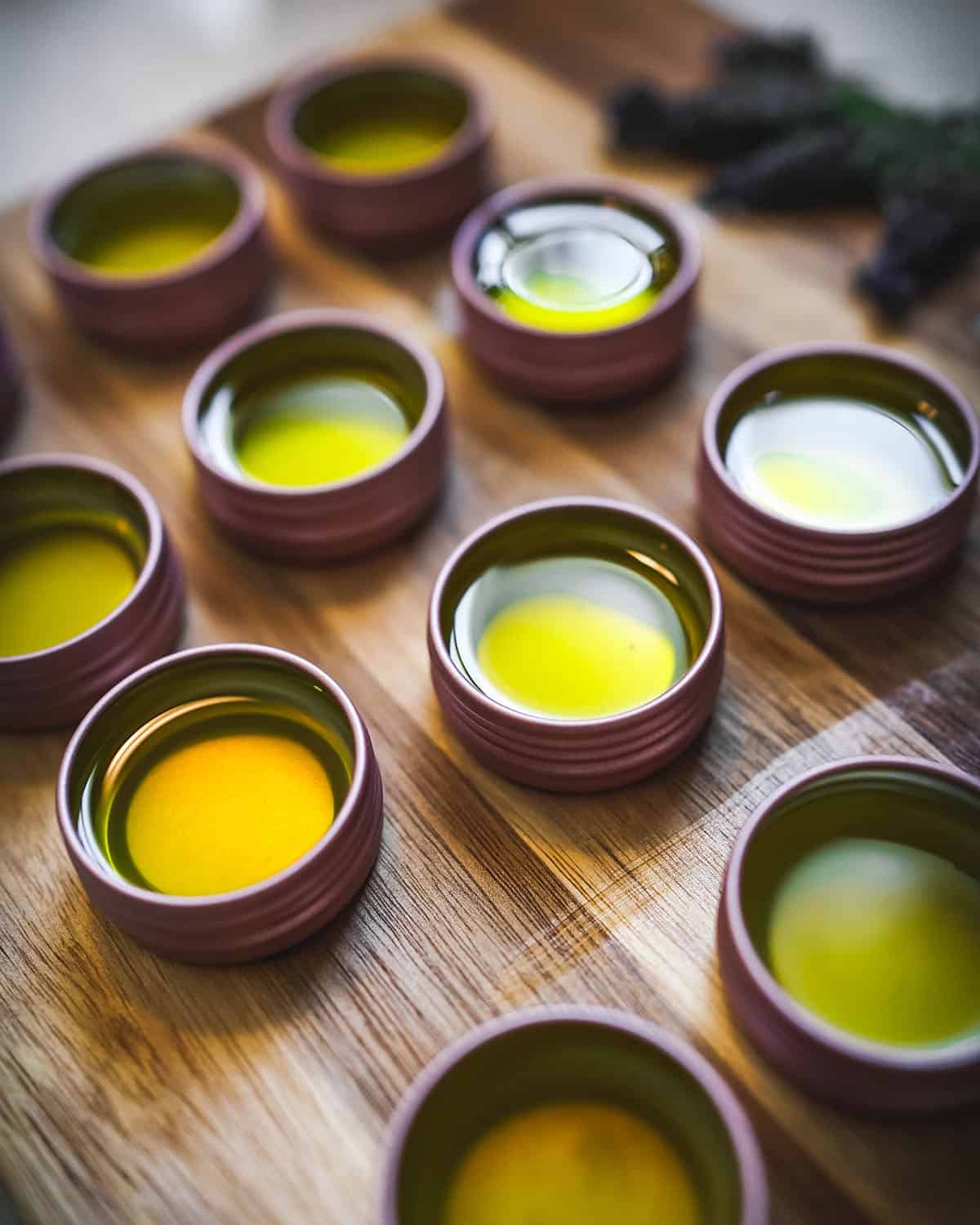 Tins of salve cooling on a wooden cutting board. 
