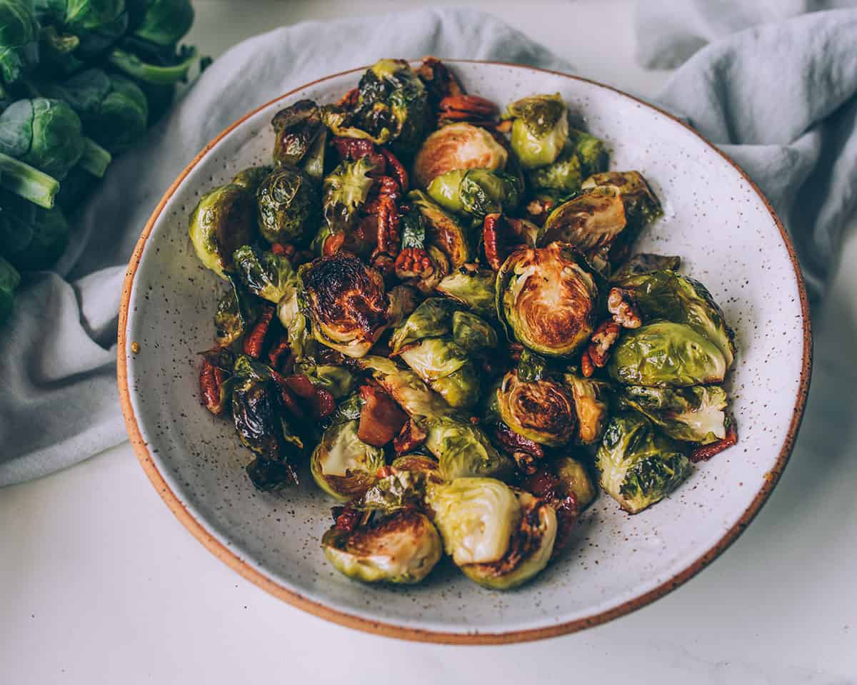 Roasted Brussels sprouts in a white bowl. 