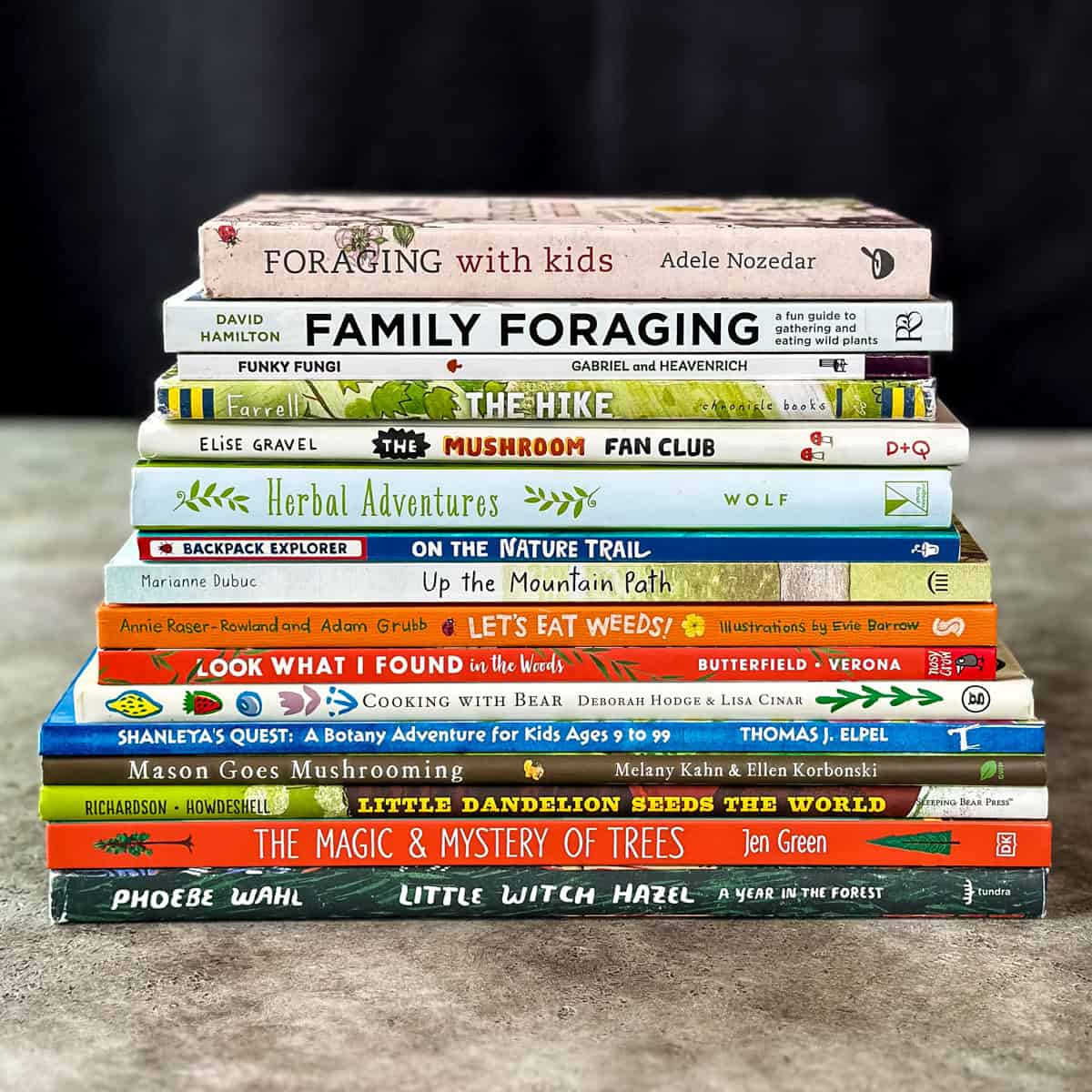 A stack of books about foraging for kids.