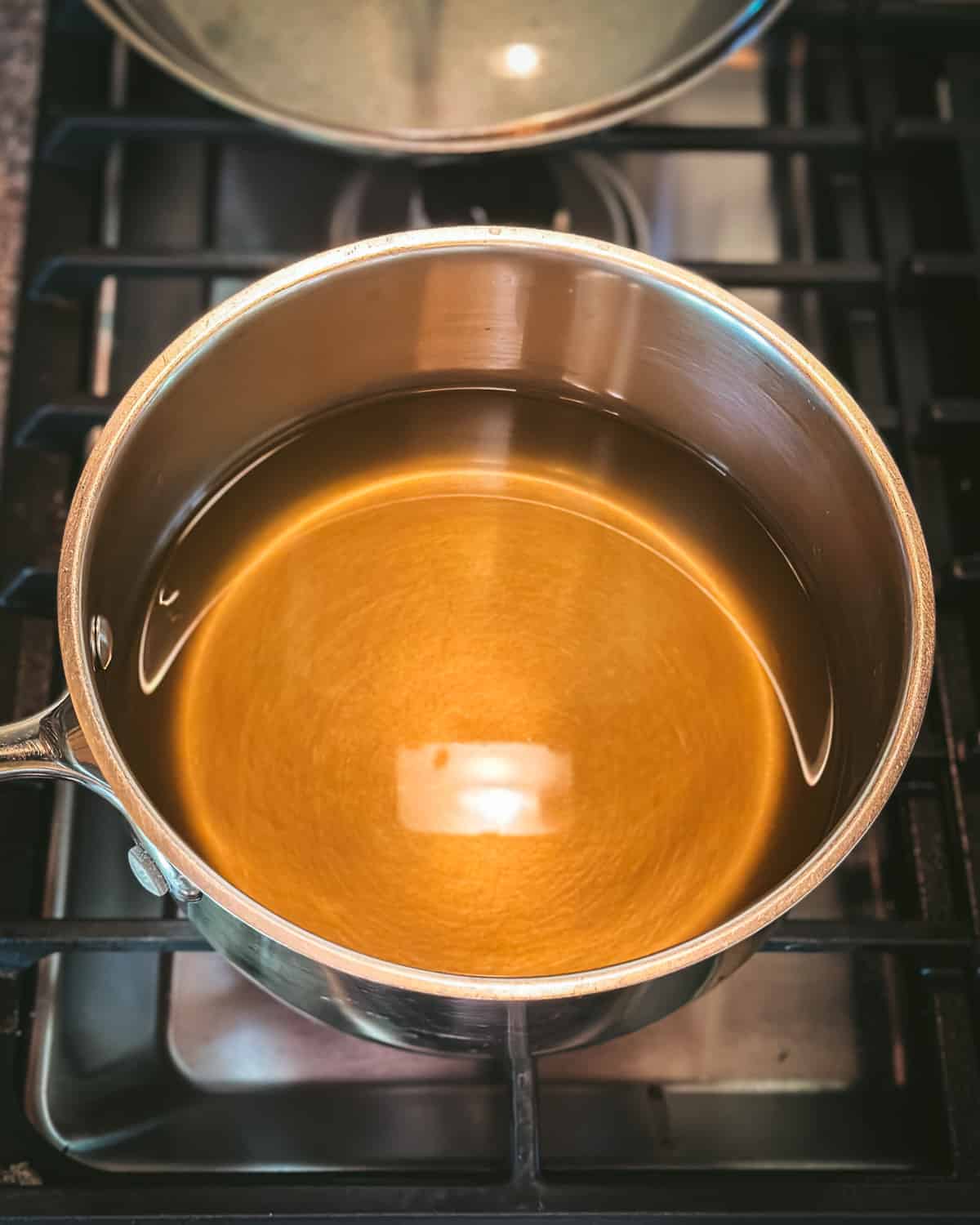 A pan with dandelion tea mixture not yet boiling.