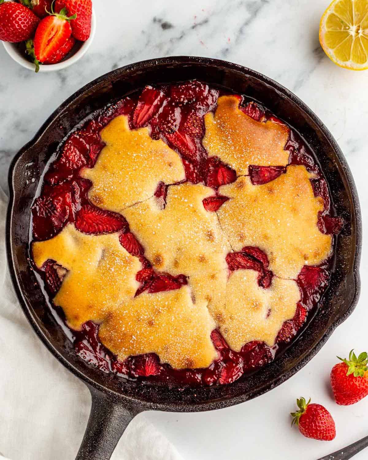 A freshly baked strawberry skillet cobbler, top view. 