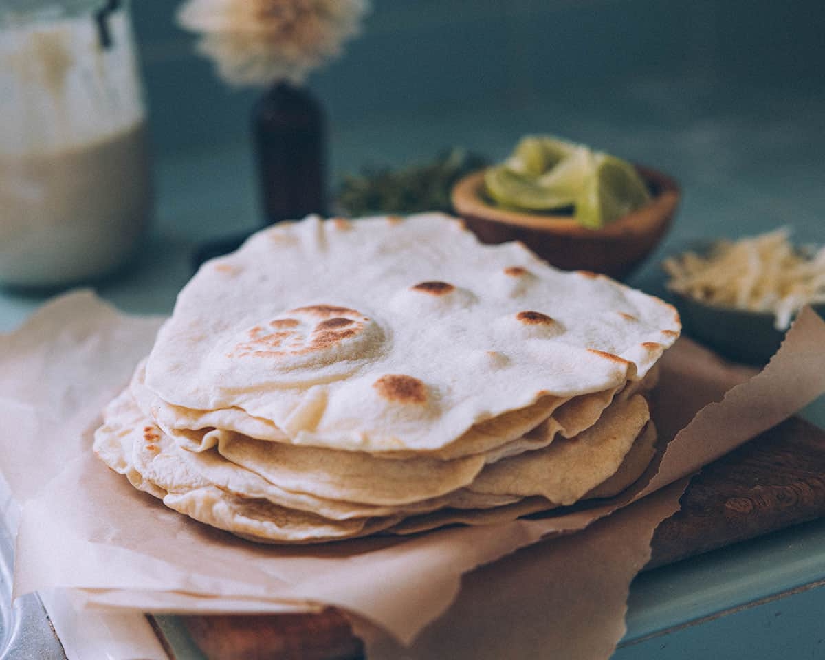 A stack of freshly cooked sourdough tortillas. 