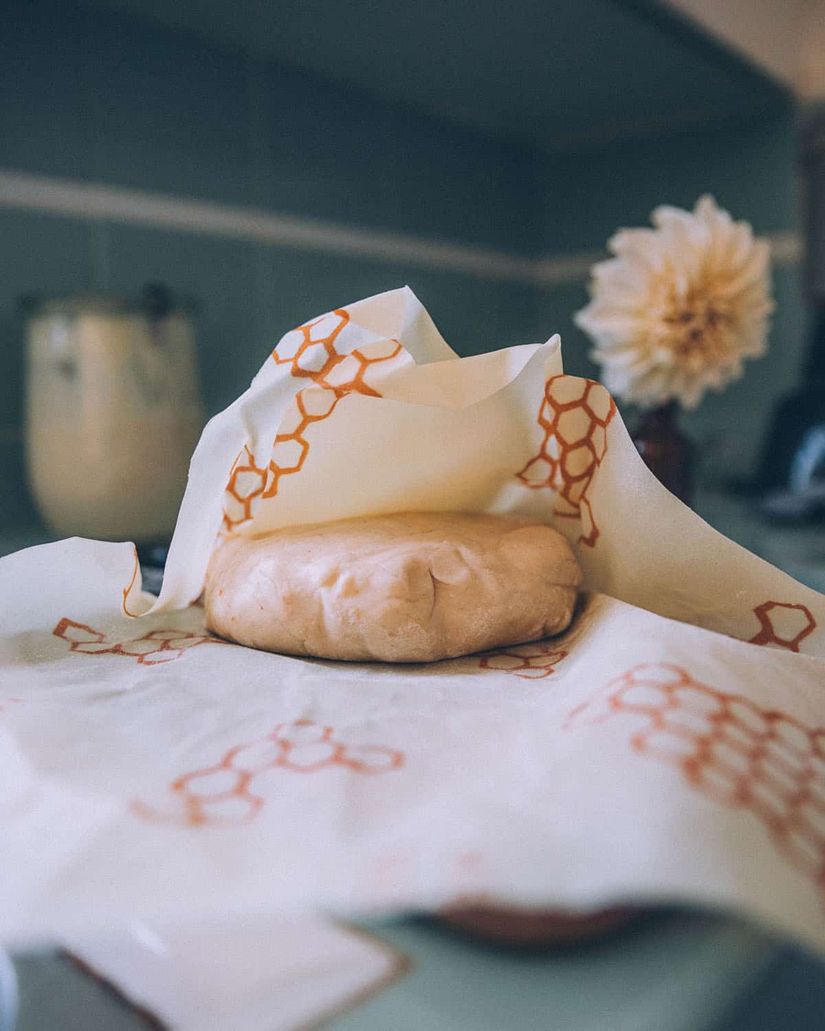 Dough for sourdough tortillas wrapped in beeswax wraps.