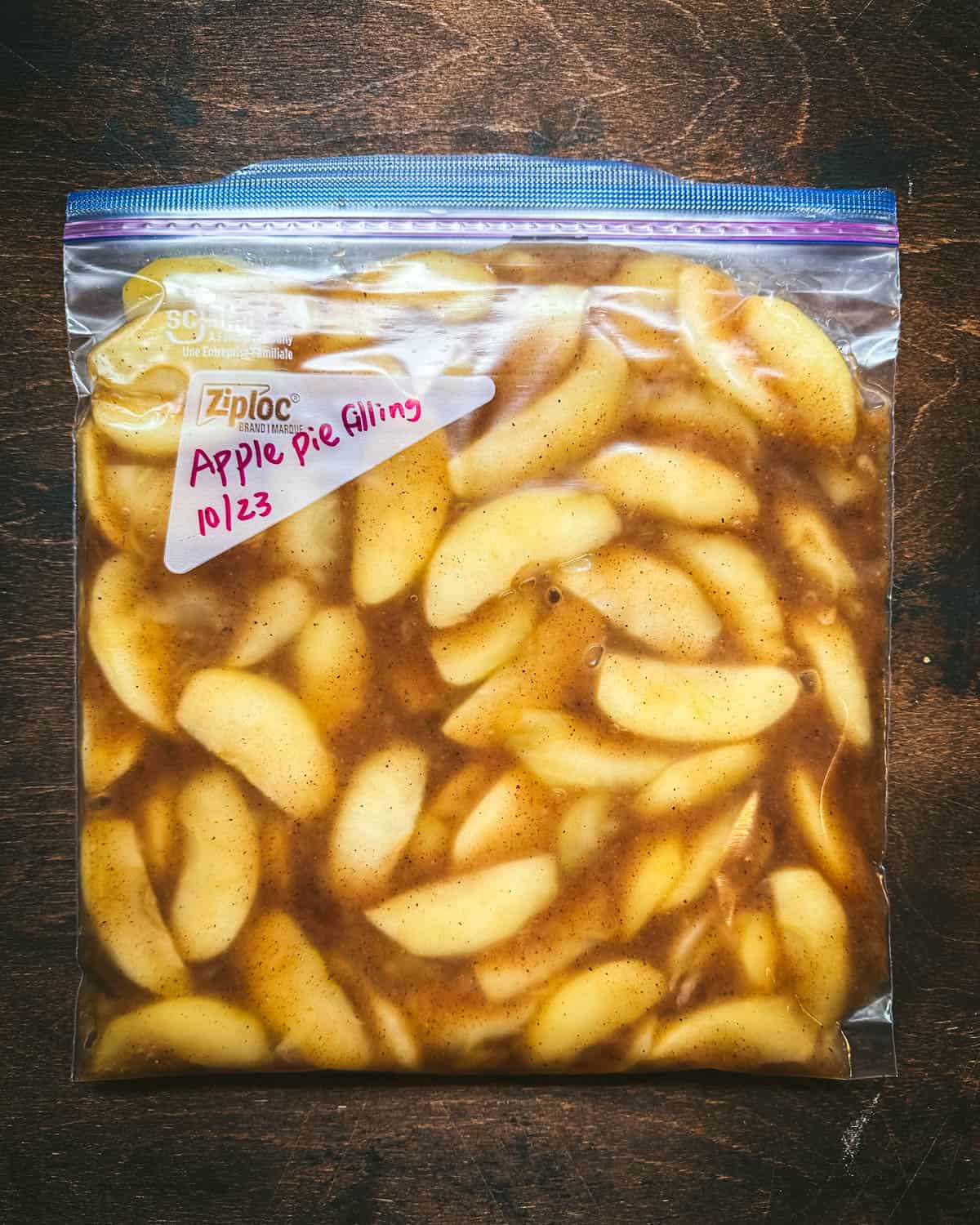 A zip top bag filled with apple pie filling and labelled. 