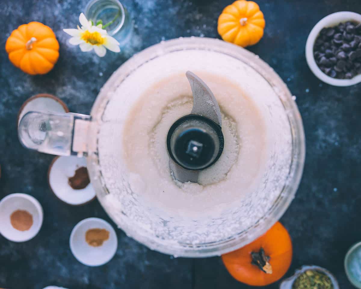 Fully processed coconut into coconut butter in a food processor, top view. 