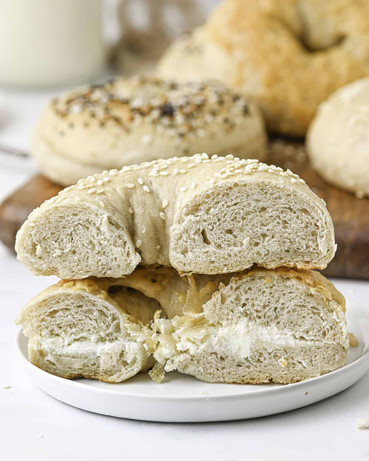 Cut sourdough bagels in a stack of two. 