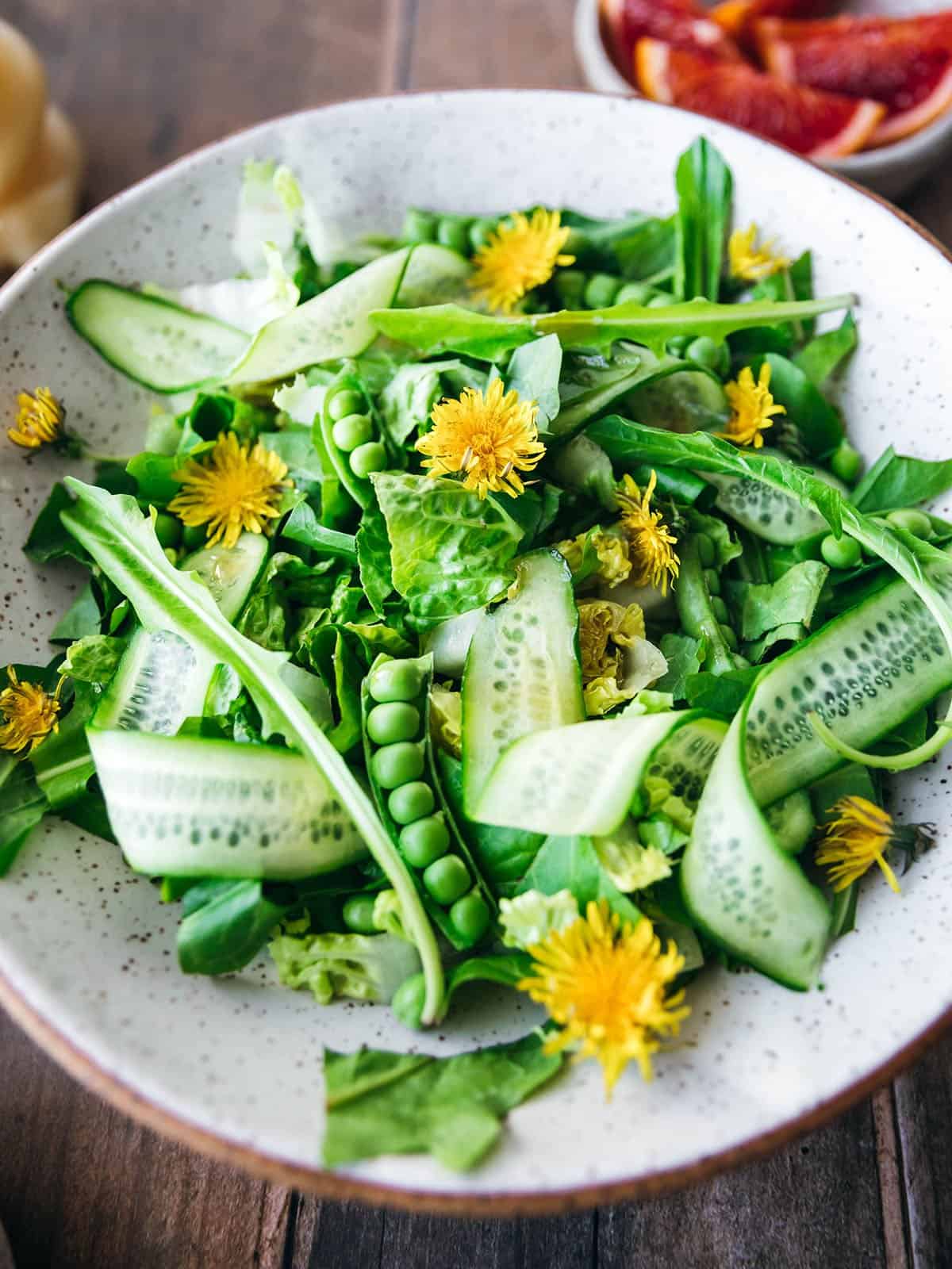 Close-up of a bowl of dandelion salad. 