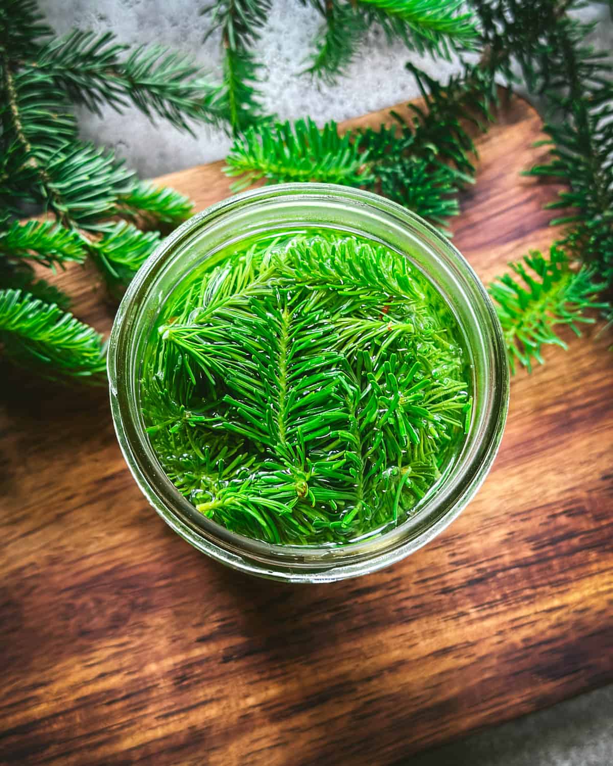 Fir tip tea cooling in the jar, top view. 