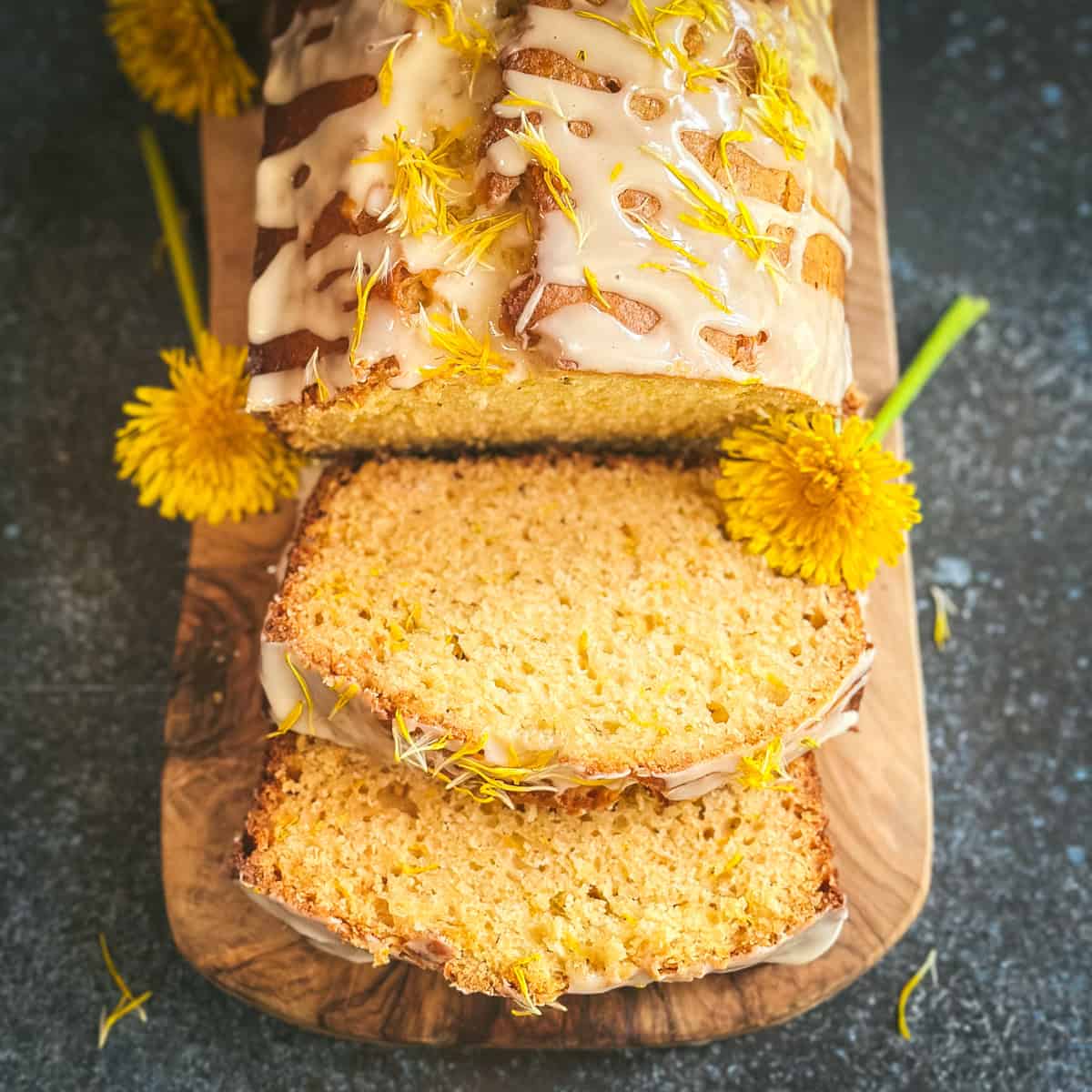 Dandelion bread, partially sliced.