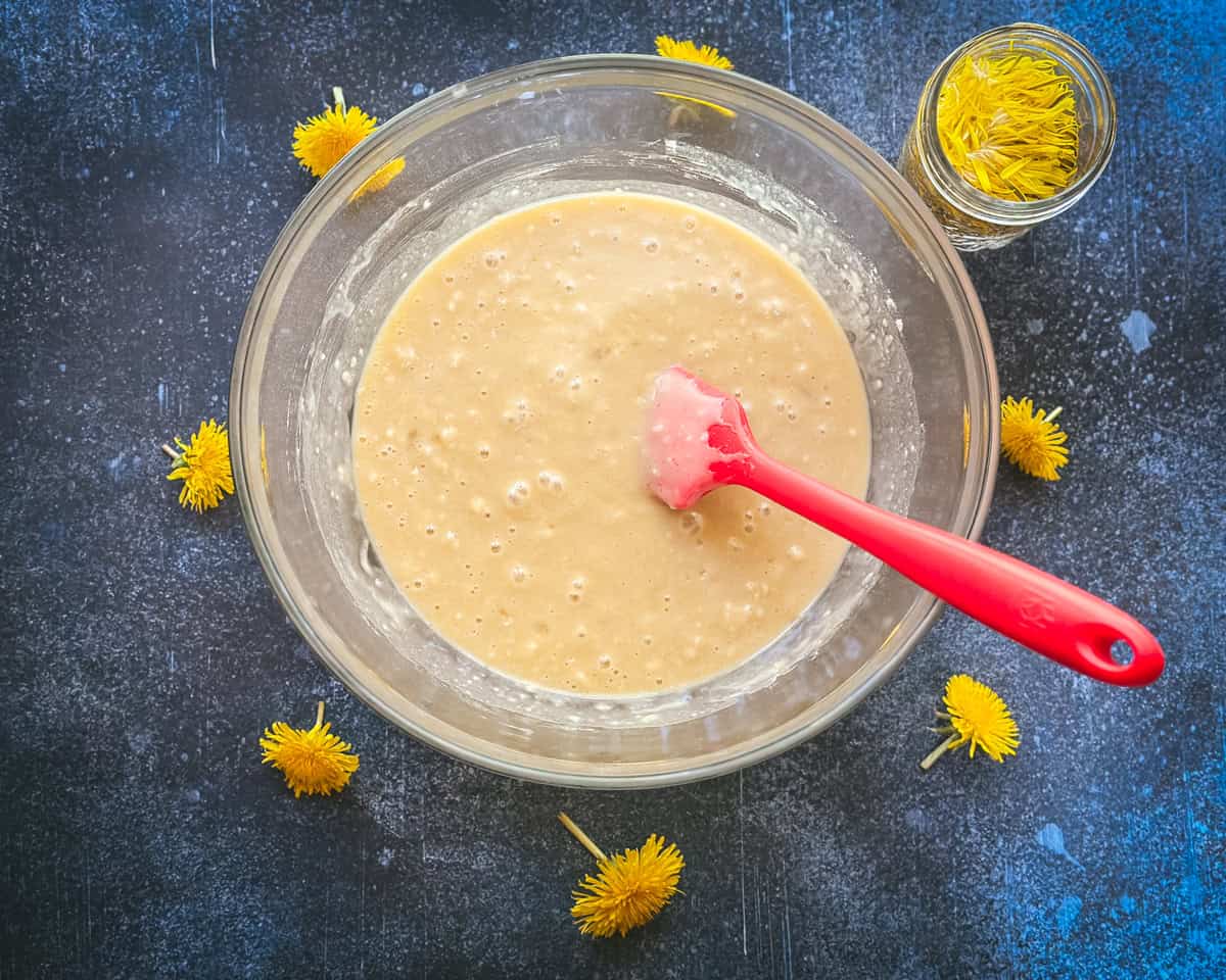 Wet and dry ingredients mixed in a bowl.