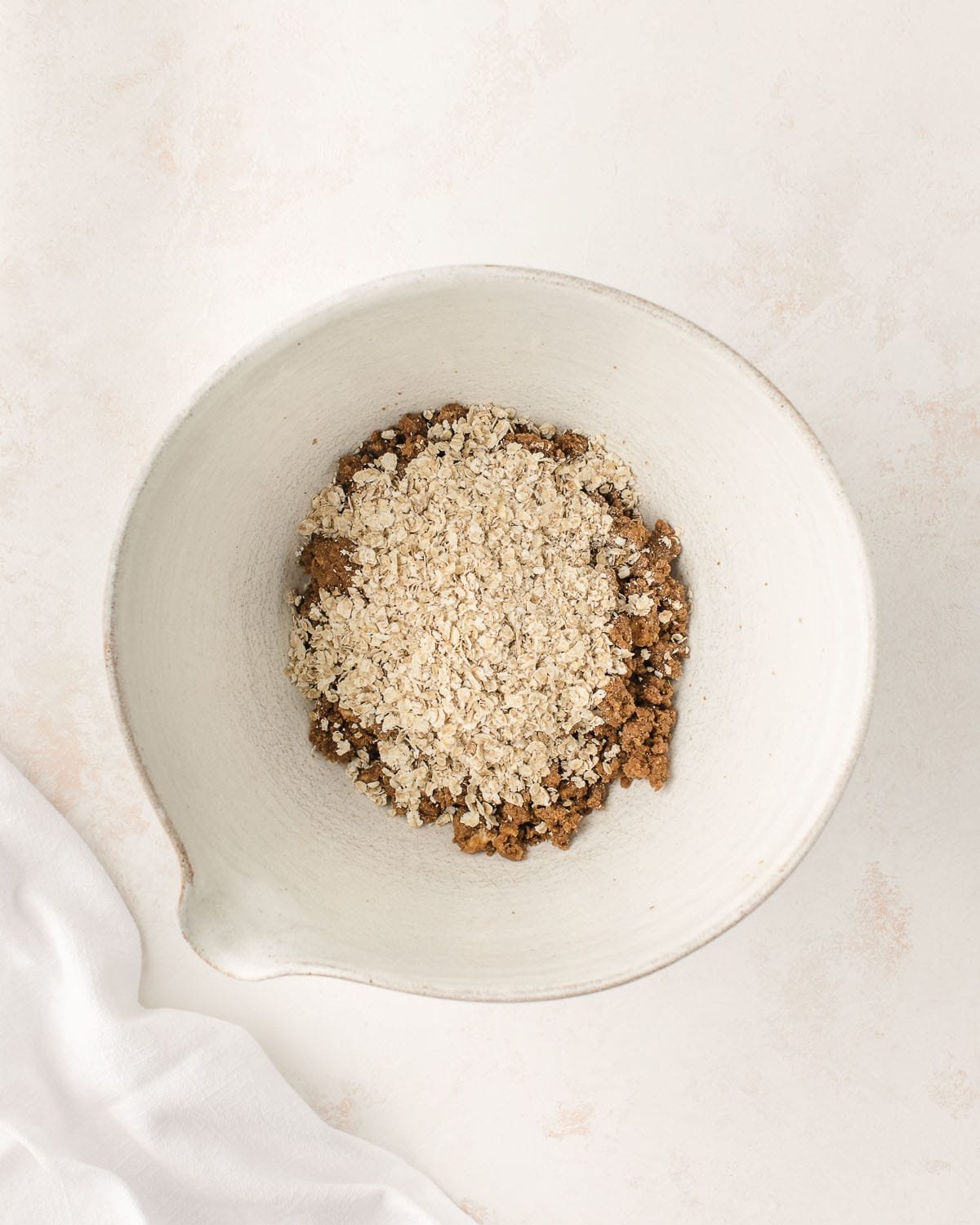Oats added to the mixing bowl. 