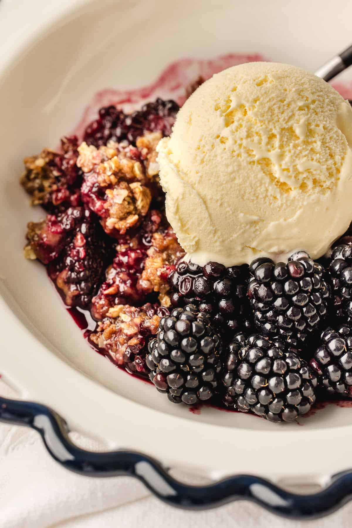 Blackberry crisp with ice cream. 
