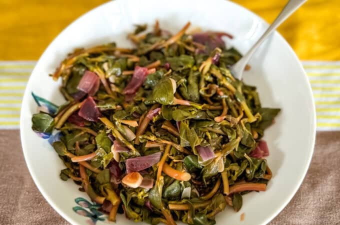 Sautéed purslane in a bowl.